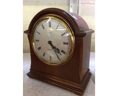 A modern mahogany cased mantle clock, inscribed to dial A. Fattorini, Harrogate: The Rotherham Clock (in working order).