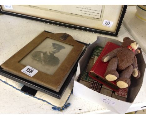 A canvas framed Military photograph frame together with other collectable items including a 1984 ceramic Steiff jointed teddy