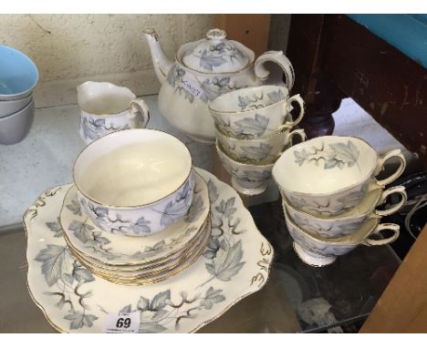 A Royal Albert bone china tea service decorated in the Silver Maple design complete for six including teapot.