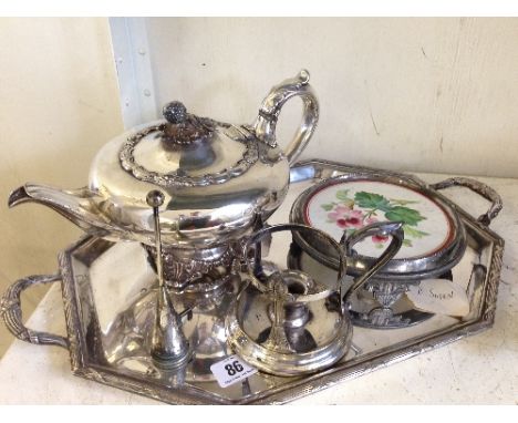 A silver plated teapot of Melon form with Strawberry knop together with a twin handled silver plated tray, a tile teapot stan