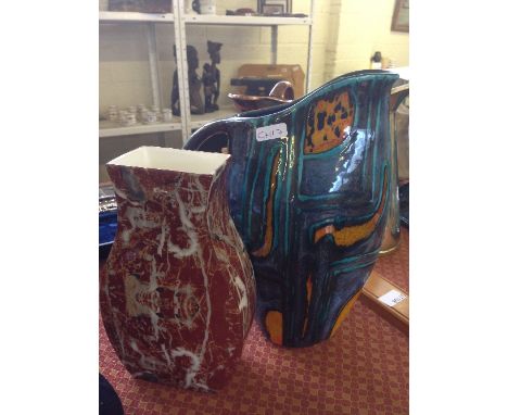 A Tradpots pottery single handle jug in the style of Poole Pottery together with an unusual Poole Pottery vase decorated in a