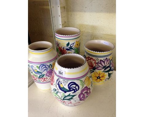 Four various large white bodied Poole Pottery vases.