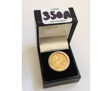 A 1911 gold Sovereign set in a 9 carat gold ring.