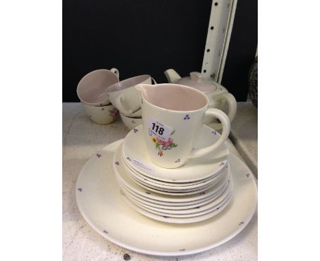 The residue of a Poole Pottery tea service, decorated in the RZ simple floral pattern.