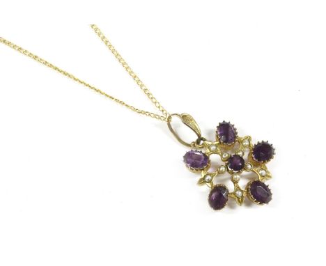 An Edwardian gold amethyst and split pearl openwork pendant, marked 9ct on gold chain3.53g