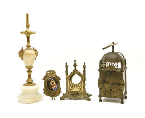 A gothic revival gilt metal pocket watch holder, together with a gilt framed enamel painting of The Madonna and child after R