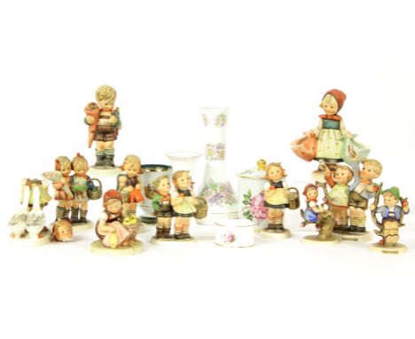 A collection of eleven Goebel figures, to include Mother’s Darling, To Market and Going to Grandma’s, together with a Limoges