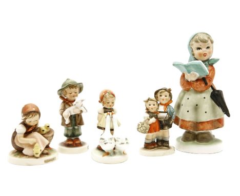 A collection of various Goebel figures
