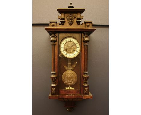 A Vienna wall clock, of typical form and with an enamelled chapter ring