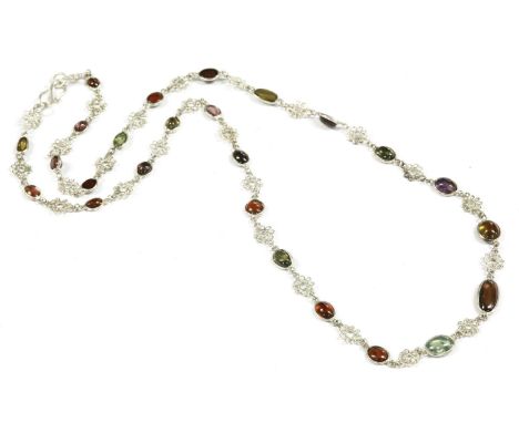 A silver spectacle set mixed amethyst cabochon necklace, interspersed between openwork floral wirework clusters of chain