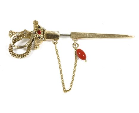 A Continental gold stick pin/hat pin in the form of a sword, with removable Scarab set with red paste stone, and a red coral 