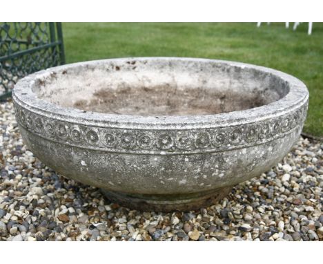 A circular cast stone planter on stand, 82cm diameter