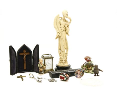A small brass carriage clock, 100cm high, a carved shell, two crucifixes and ornaments