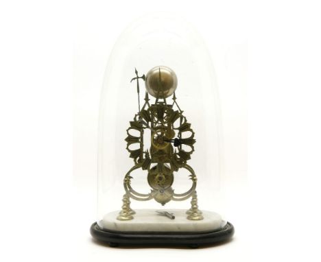 A Victorian brass skeleton clock under a glass dome, with single fusee movement and hammer strike bell, on a white marble and