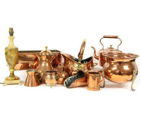 A collection of mixed copper wares, a planter, kettle scuttle, three shades and a table lamp