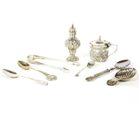 A silver caddy spoon, with shell decorated bowl, Birmingham 1978; together with a silver mustard pot a a small collection of 