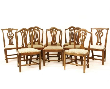 A set of six mahogany country Hepplewhite single dining chairs, with arched backs, pierced splats and drop in seats two more,