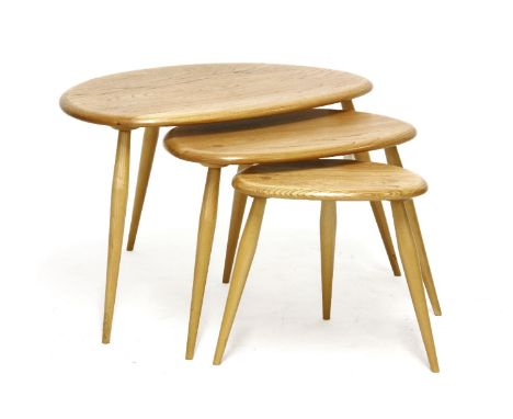 An Ercol elm pebble design nest of three tables