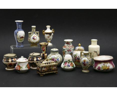 A box with small ceramic items: vases, box and cover, pepperette, inkwell, etc