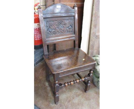 A 17th Century oak Lancashire Chair with panel back, solid seat on turned and square front legs