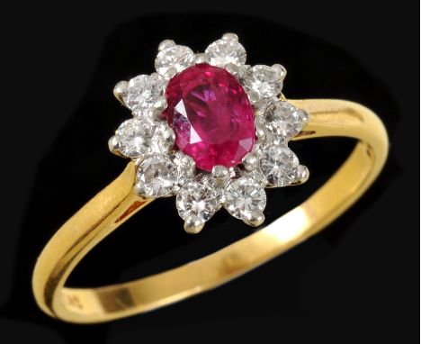 A Ruby and Diamond Cluster Ring claw-set oval-cut ruby, approx 0.60cts, within a frame of brilliant-cut diamonds in 18ct gold