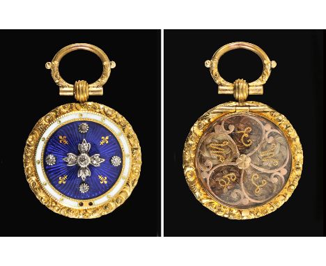 An Enamel and Diamond Pendant set nine old-cut stones on blue guilloche enamel ground in foliate frame, enclosed lock of hair
