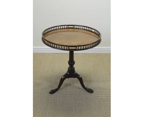 A 19th Century mahogany Supper Table with circular top having spindle gallery and hand holds on turned and spiral fluted colu
