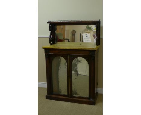 A Regency rosewood Chiffonier with brass gallery, mirror back, scroll supports with fruiting vine terminals, marble top above