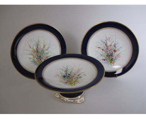 A Grainger Worcester part Dessert Service painted bunches of heathers with a royal blue border and gilt edge, viz: ten Plates