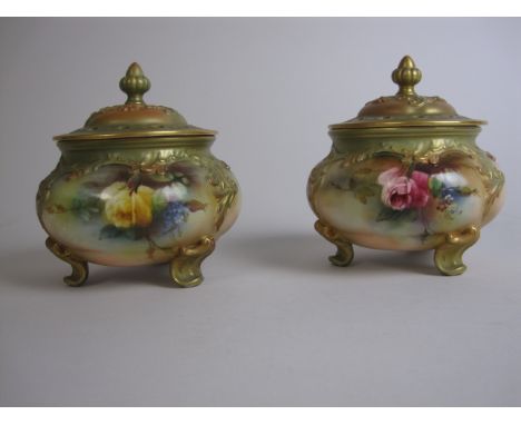 A pair of Hadley Royal Worcester Pot Pourri Vases with moulded and pierced lids, painted roses, moulded leaf and scroll decor