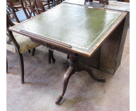 A 19th Century oak Writing/Reading Table with square hinged adjustable top having green inset leather, fitted drawer on turne