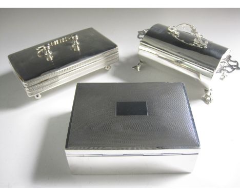 An Edward VII silver oval Cigarette Box with inscription and pierced handles, London 1905, another with engraved decoration o