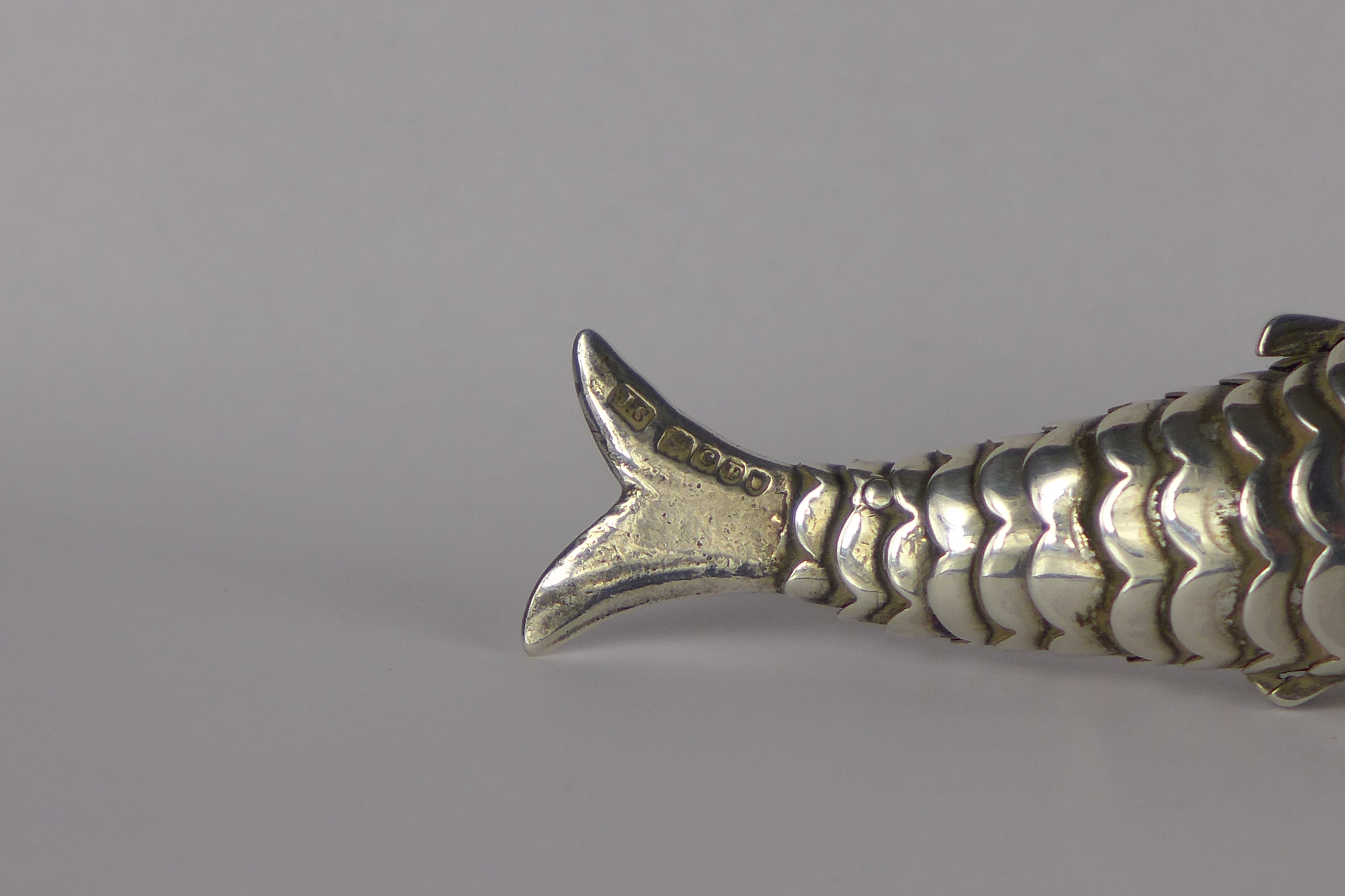 A Victorian Continental silver articulated Fish with hinged head inset