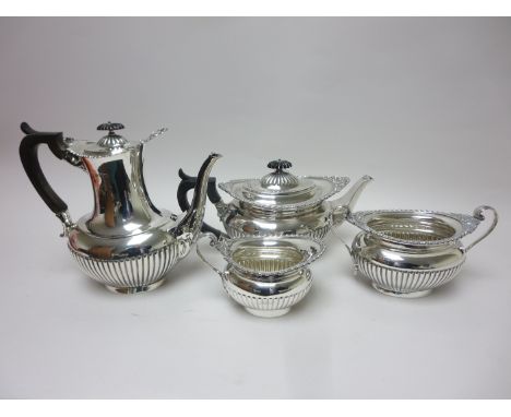 An Edward VII silver Tea and Coffee Service of oval semi-fluted form with gadroon and scroll borders, London 1901 and Sheffie