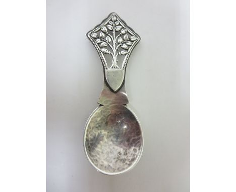 A George V Arts & Crafts silver Caddy Spoon with hammered bowl and tree of life stem, London 1929, maker: Henry George Murphy