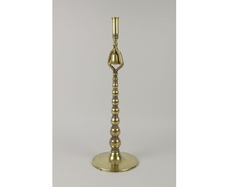 A 19th Century brass Candlestick with bell upon bobbin column and circular foot, 23in, and a brass Table Lamp with bulbous fl