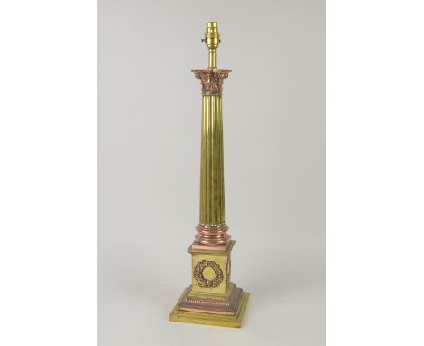 A large copper and brass Table Lamp with corinthian column and garlands to the stepped base, 21in H