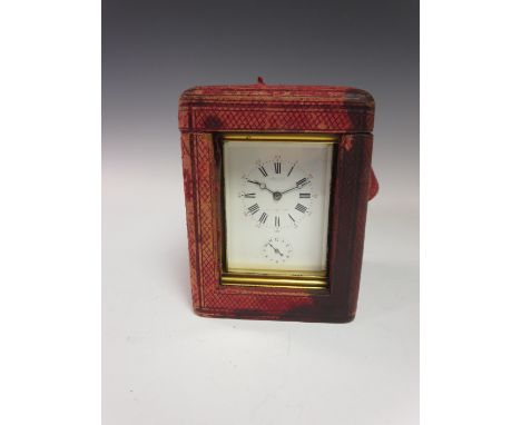 A 19th Century French Carriage Clock with white enamel dial and subsidiary alarm dial, hour repeater and striking movement, e