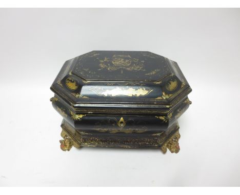 An early 19th Century Chinese export Lacquer Tea Caddy of octagonal bombe form with gilt design on a black ground, carved gil