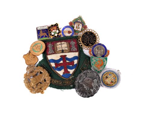 A WWII Third Reich black wound badge, together with a Tank Corps badge, a mourning brooch a selection of silver badges, plus 