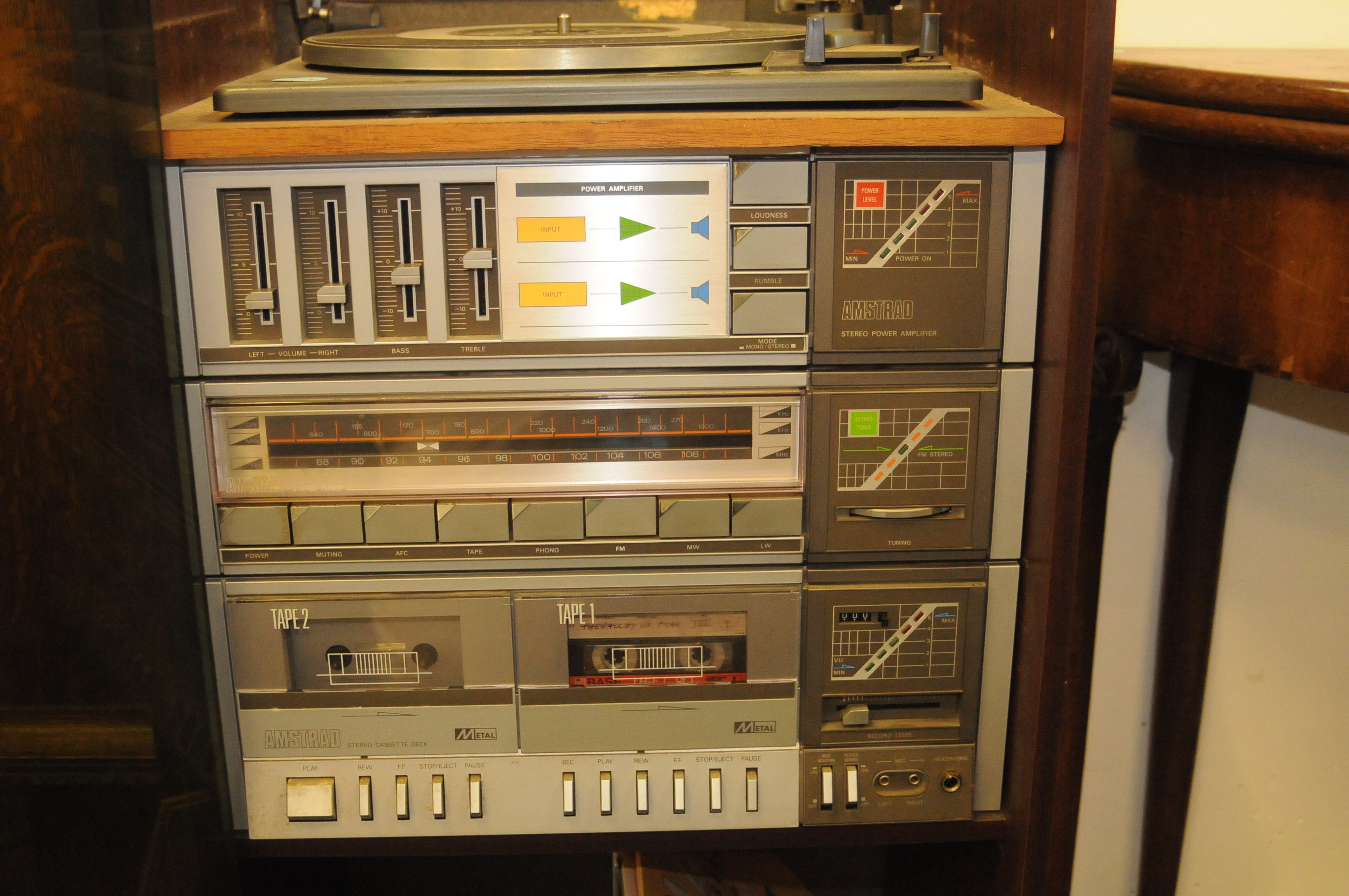 A retro Amstrad HIFI in comprising double cassette deck
