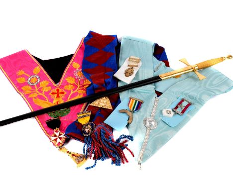 A group of modern Masonic items, including a sword in scabbard, various aprons of different design, and assortment of jewels,