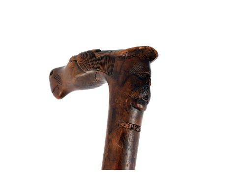 A 19th century carved horse head walking stick, the carved horse head handle with carved head to reverse, marked Kepkypa 