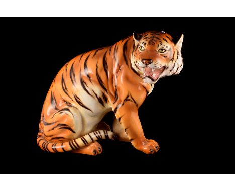 A group of three ceramic Tigers, in graduated form of a adult and two cubs.(3) 