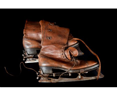 Two pairs of vintage ice skating boots, in original carry cases together with two further pairs and spare blades.(3) 