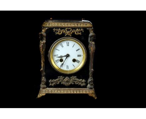 A French Mantle Clock, with ormolu mounts and ebonised case( handle missing), white enamel dial with Roman numerals , 8 day m