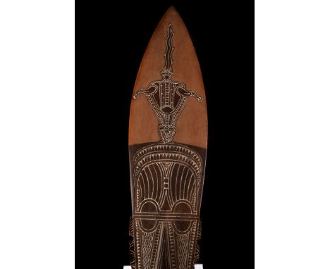 A Vintage tribal paddle, possibly from Papua New Guinea, of one piece carved construction with decorated zoomaphoric design A