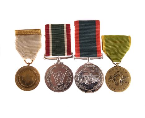 An interesting assortment of WWII women's military medals, to include the Women's Voluntary Service medal, the Women's Land A