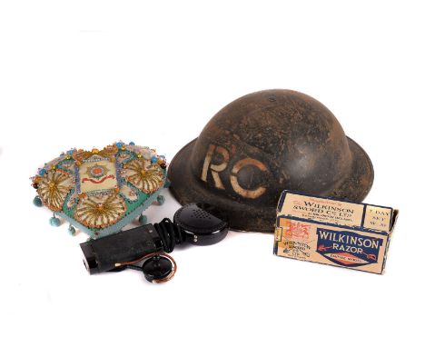 A military brody helmet, marked RC, together with a Tommy gun manual, razors, field glasses in carrier, a Worcester Regiment 