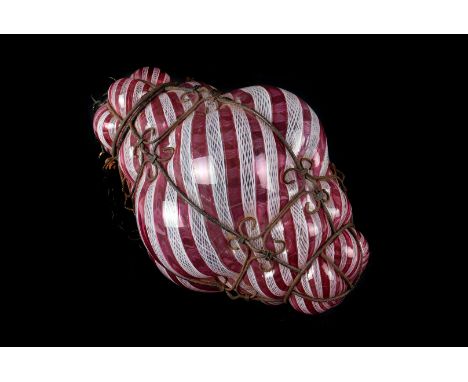 A pair of 20th Century blown glass pendant lights,  in pink and white net, striated pattern with indented bound wire surround
